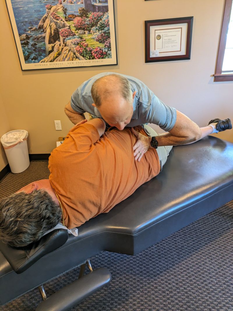 Dr. Vince Morson providing chiropractic back adjustment in Olympia WA